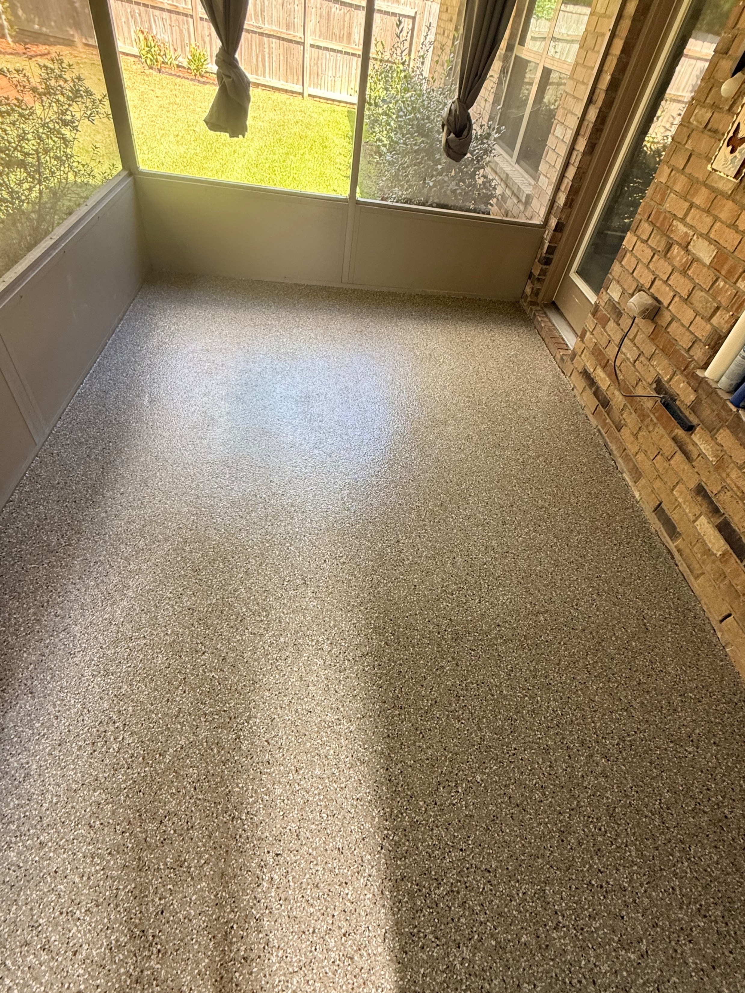 After — flake floor coating applied to sunroom